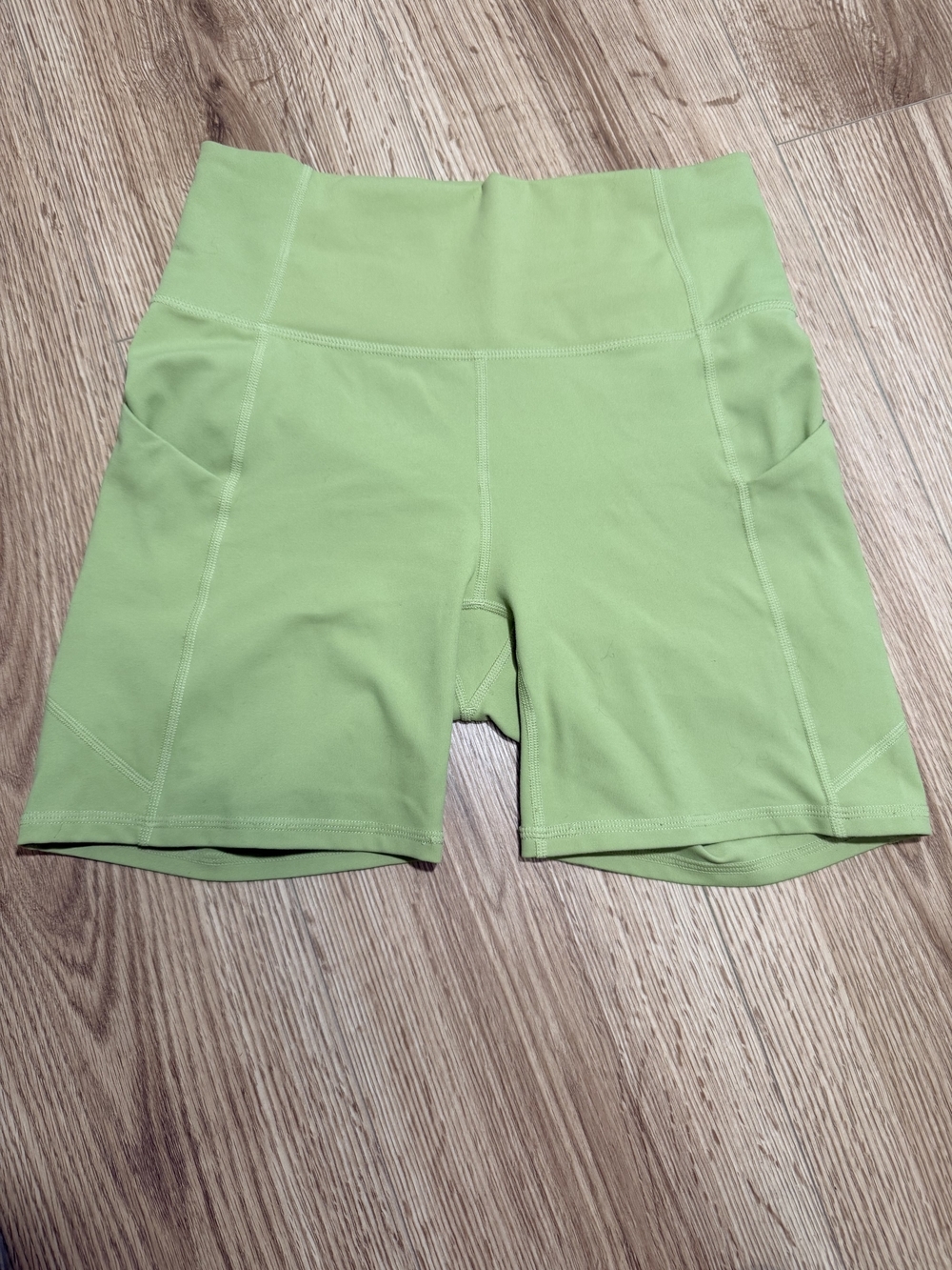 Fabletics High-Rise Lime Green Bike Shorts with Side Pockets